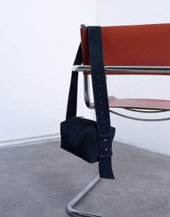 Model wearing Chloe real suede cross body bag in navy