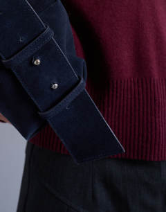 Model wearing Chloe real suede cross body bag in navy