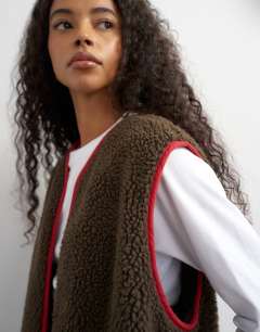 Model wearing Chuck on borg gilet in choc