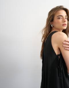 Model wearing Chuck on boxy playsuit in black cupro