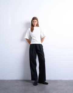 Model wearing Cinch back detail structured top in ivory