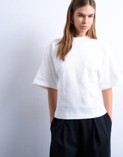 Model wearing Cinch back detail structured top in ivory