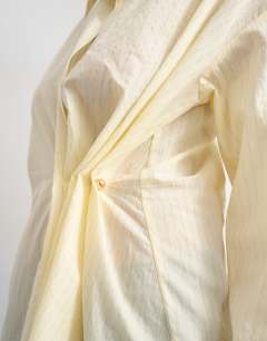 Model wearing Cinch front detail shirt in yellow stripe
