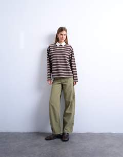 Model wearing Cinch low rise jean in green cord