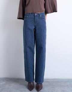 Model wearing Cinch low rise jean in tufted detail indigo rinse stripe