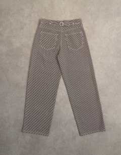 Model wearing Cinch low rise relaxed fit jean in choc stripe