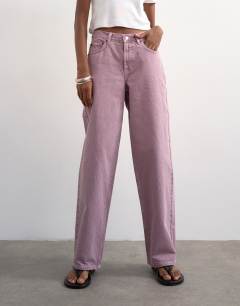 Model wearing Cinch low rise relaxed fit jean in purple