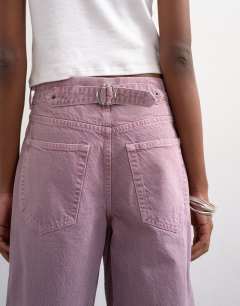 Model wearing Cinch low rise relaxed fit jean in purple