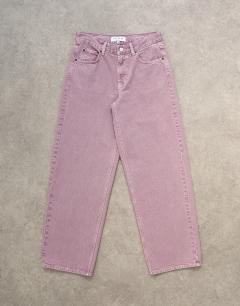Model wearing Cinch low rise relaxed fit jean in purple