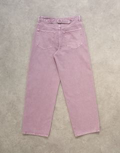 Model wearing Cinch low rise relaxed fit jean in purple