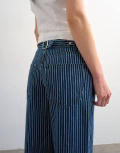 Model wearing Cinch low rise relaxed jean in blue stripe
