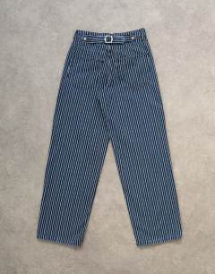 Model wearing Cinch low rise relaxed jean in blue stripe