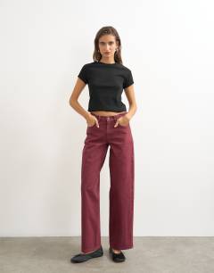 Model wearing Cinch low rise relaxed jean in cherry red
