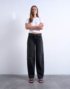 Model wearing Cinch low rise relaxed jean in washed black