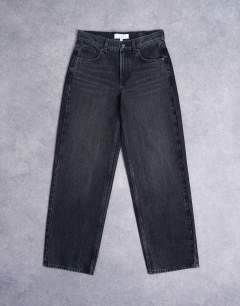 Model wearing Cinch low rise relaxed jean in washed black