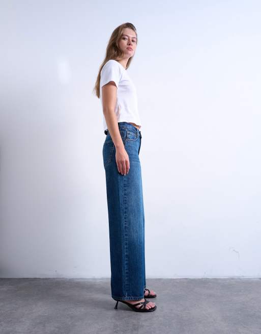 Topshop Cinch low rise relaxed jeans in mid blue