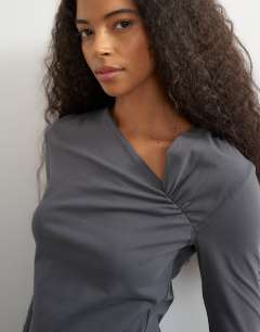 Model wearing Cinch neckline long sleeve top in grey