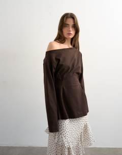 Model wearing Cinch off the shoulder top in chocolate