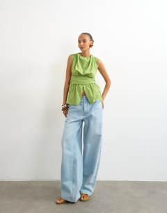 Model wearing Cinch split front top in green stripe