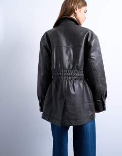 Model wearing Cinch waist PU jacket with contrast cord collar in black