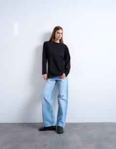 Model wearing Cinch waist skater tee in black