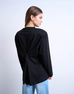 Model wearing Cinch waist skater tee in black