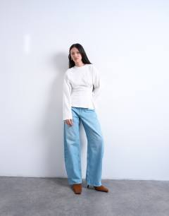 Model wearing Cinch waist structured long sleeve tee in white