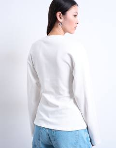 Model wearing Cinch waist structured long sleeve tee in white