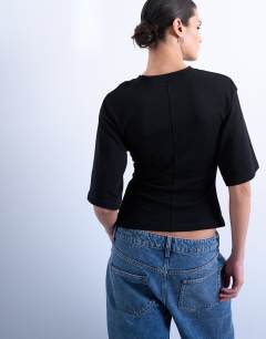 Model wearing Cinch waist structured tee in black