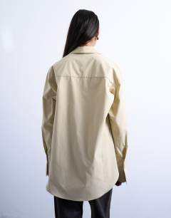 Model wearing Cinched oversized poplin shirt in stone