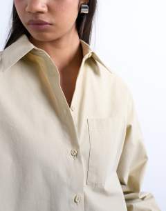Model wearing Cinched oversized poplin shirt in stone