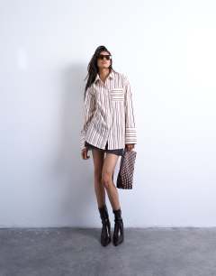 Model wearing Cinched oversized poplin shirt in stripe
