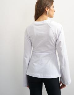 Model wearing Cinched waist long sleeve raglan t-shirt in white