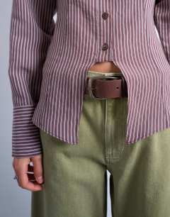 Model wearing Cinched waist shirt with cut away placket in burgundy stripe