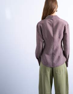 Model wearing Cinched waist shirt with cut away placket in burgundy stripe