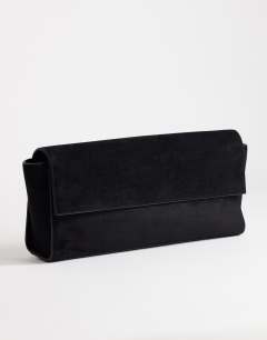 Model wearing Clark medium suedette fold over clutch bag in black
