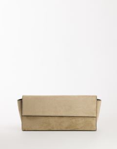 Model wearing Clark medium suedette fold over clutch bag in sand