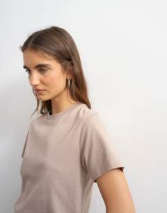 Model wearing Classic tee in stone