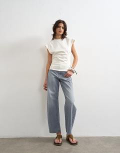 Model wearing Clean corset seamed cap sleeve top in ivory