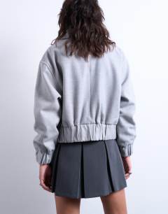 Model wearing Clean cropped quilted lined bomber with wool in light grey