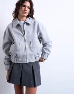 Model wearing Clean cropped quilted lined bomber with wool in light grey