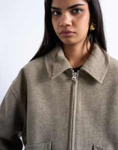 Model wearing Clean cropped quilted lined bomber with wool in taupe