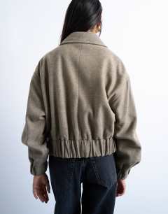 Model wearing Clean cropped quilted lined bomber with wool in taupe