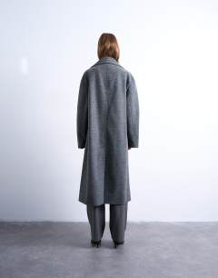 Model wearing Clean double breasted longline coat in charcoal