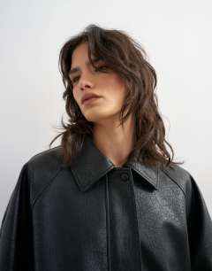 Model wearing Clean faux leather bomber jacket in black