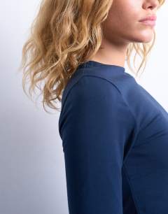 Model wearing Clean long sleeve top in navy