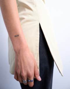 Model wearing Clean longline tunic bandeau top in taupe