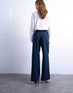 Model wearing Clean pull on tailored trouser in navy 