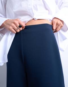 Model wearing Clean pull on tailored trouser in navy 