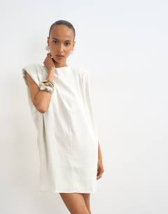Model wearing Clean structured shoulder pad mini dress in off white